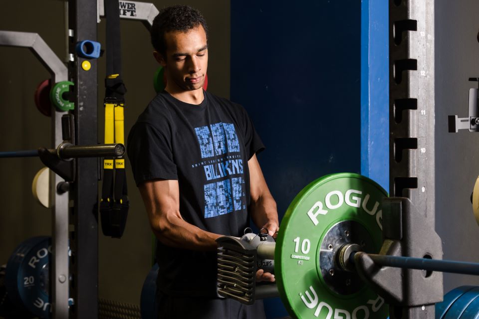 Ekindi using a UClip to lift weights