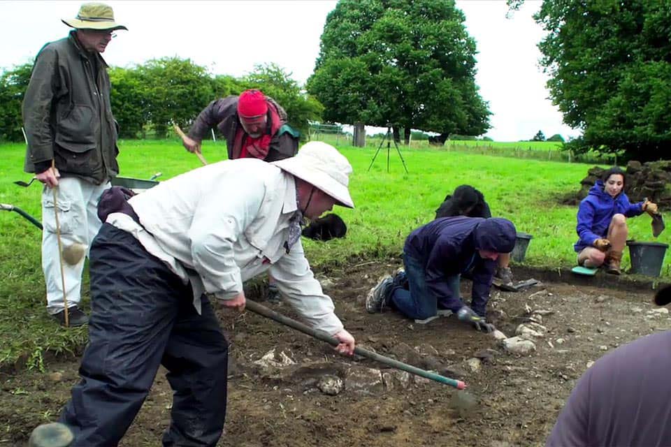 SLU archaeologist Thomas Finan, Ph.D., (standing, left), his students and Irish colleagues are continuing to excavate the remains of a medieval royal settlement on the shores of Lough Key, Ireland.