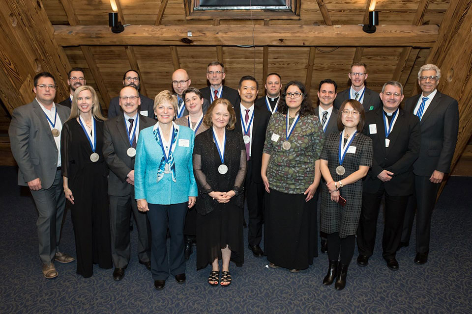 Investiture ceremony honorees with University President Fred P. Pestello, Ph.D.