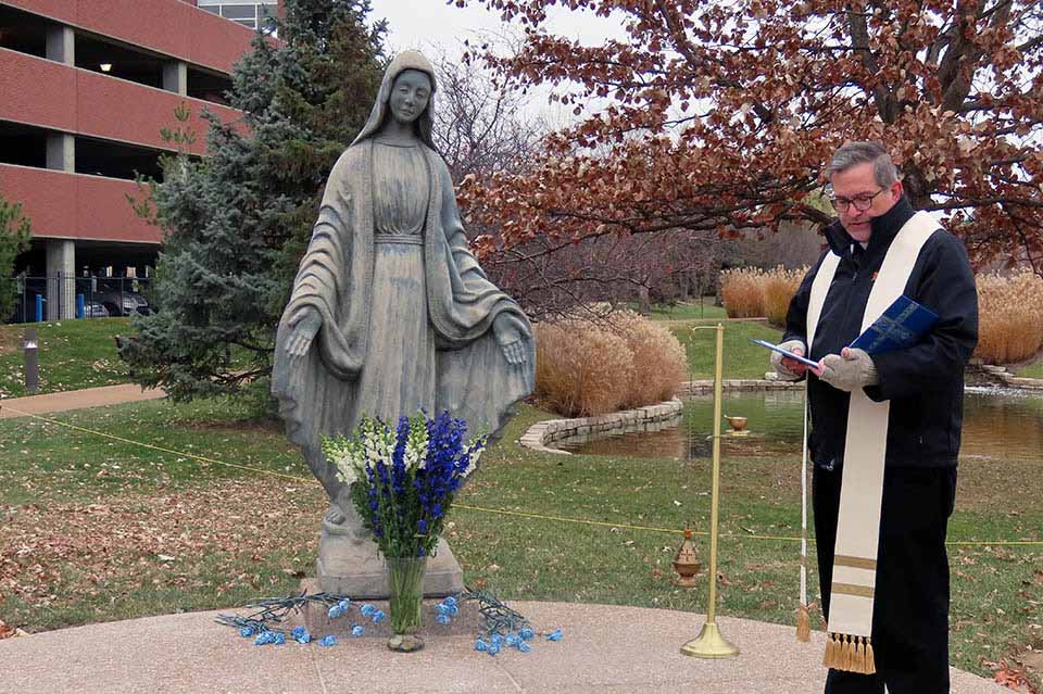 David Suwalsky, S.J., vice president for mission and identity at Saint Louis University, dedicates a new Marian prayer grotto. 