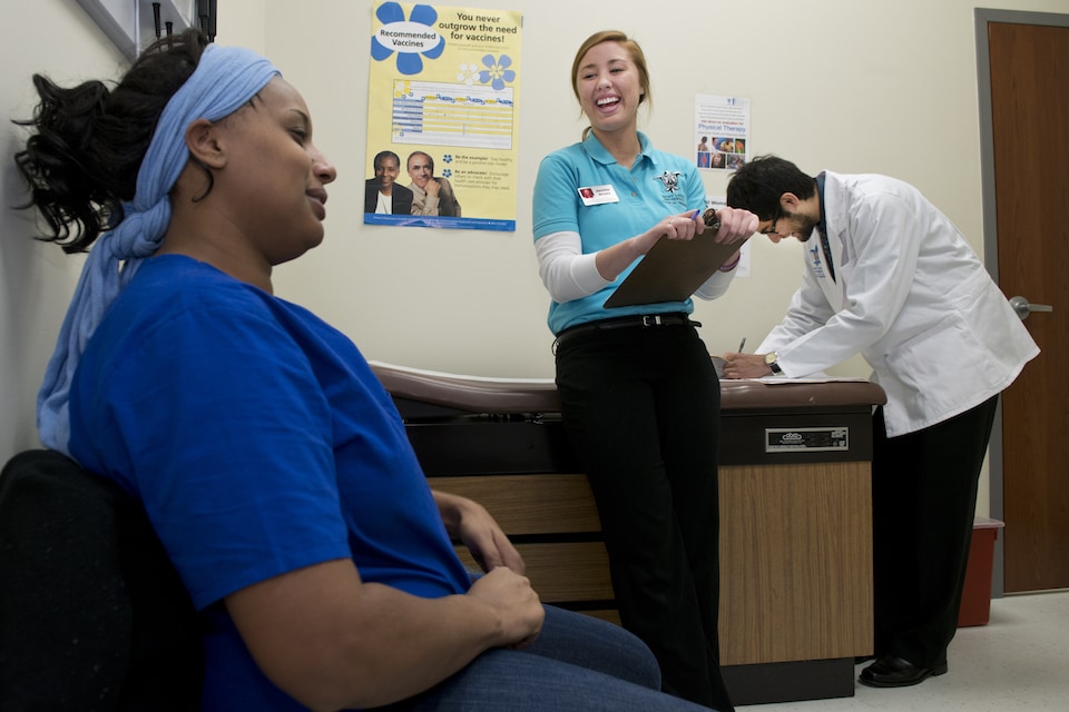 Students work with a patient at the HRC.