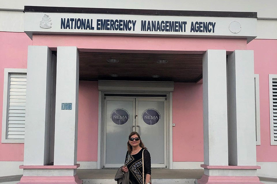 Joanne Langan, Ph.D., RN, stands before the Bahamas National Emergency Management Agency. Langan was in the country to give a talk to Bahamian nurses and health care officials. Submitted photo