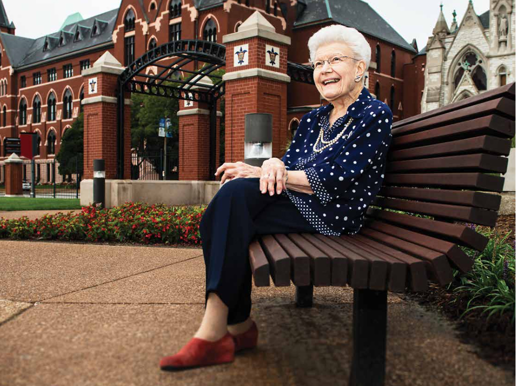 Mary Bruemmer sits on a bench contemplating her more than six decades of service to SLU.