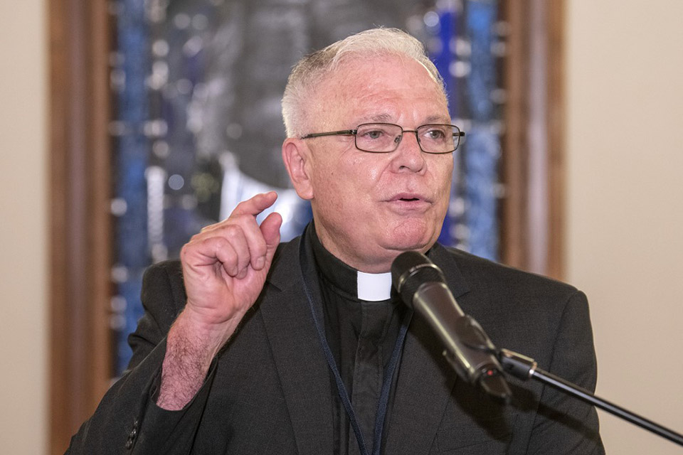 A photo of AJCU President and SLU Trustee Michael Garanzini, S.J., speaking at an AJCU leadership forum event