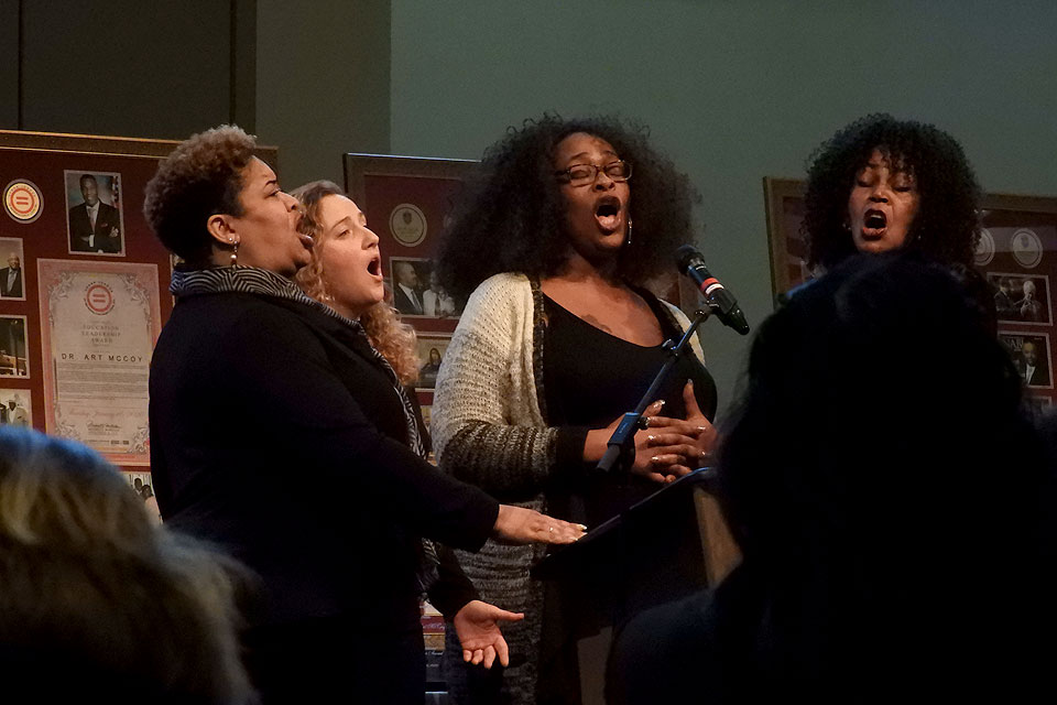 Members of the St. Louis Community Ensemble sing.