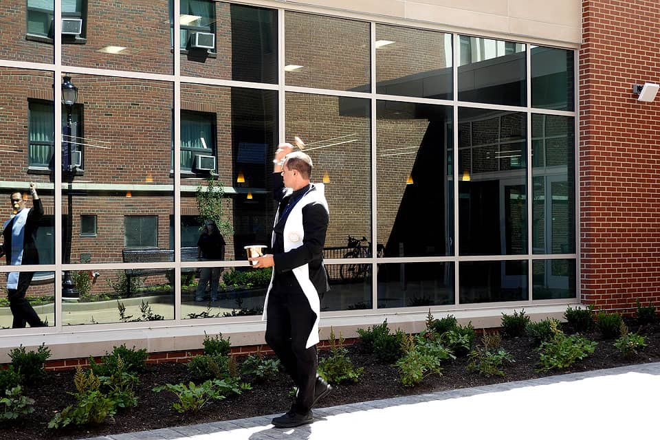 Robert Murphy, S.J., blesses Grand Hall