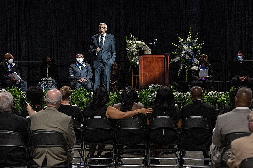 SLU President Fred P. Pestello, Ph.D., speaks at a memorial service for Jonathan Smith, Ph.D., vice president for diversity and community engagement, on June 30, at Chaifetz Arena. Photo by Steve Dolan.