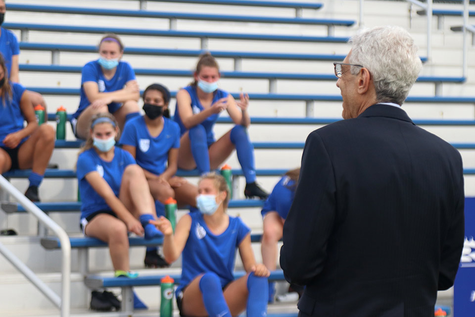 SLU President Fred P. Pestello, Ph.D., speaks to the women's soccer team