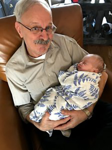 Officer Bob Petersen with his grandson, Jack.