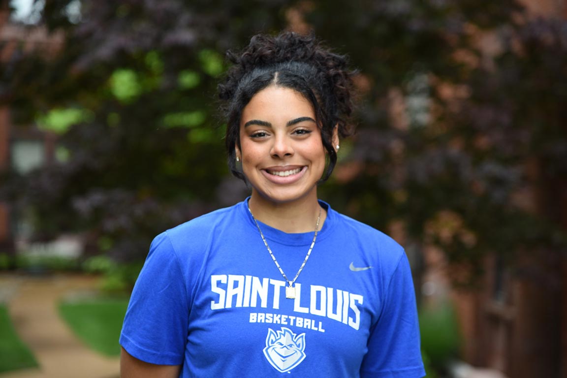 Peyton Kennedy smiles for the camera. She wears a short-sleeve Billiken T-shirt.