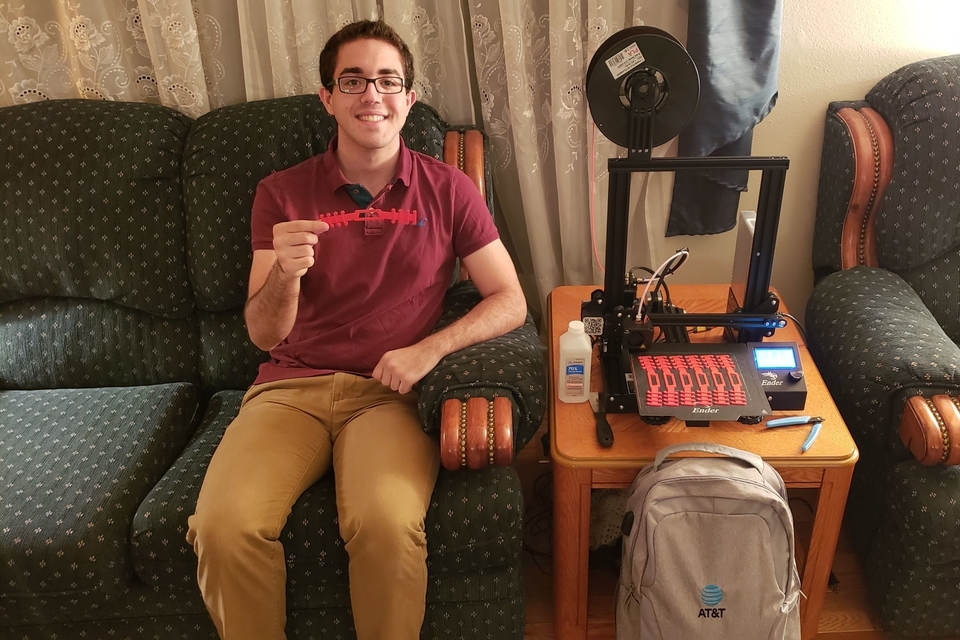 Parssa Sazdar holds an ear saver he 3-D printed as part of a project with his AT&T internship.