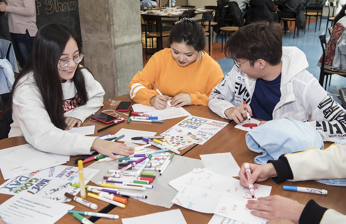 Students writing cards