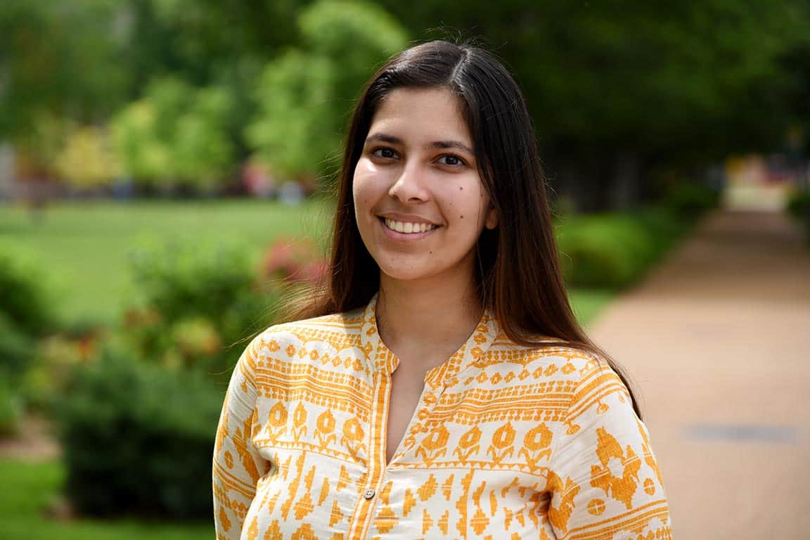 Saloni Shringarpure smiles for a photo taken outdoors on SLU's campus. 