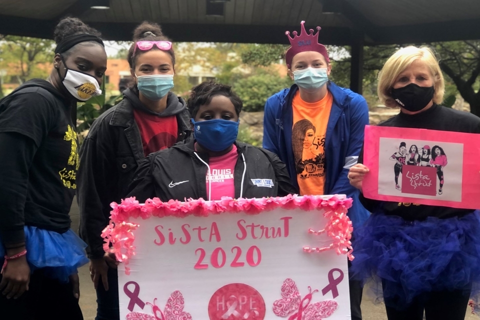 Members of SLU's Fairy God Walkers gather at a socially distanced walk site for this year's Sista Strut.