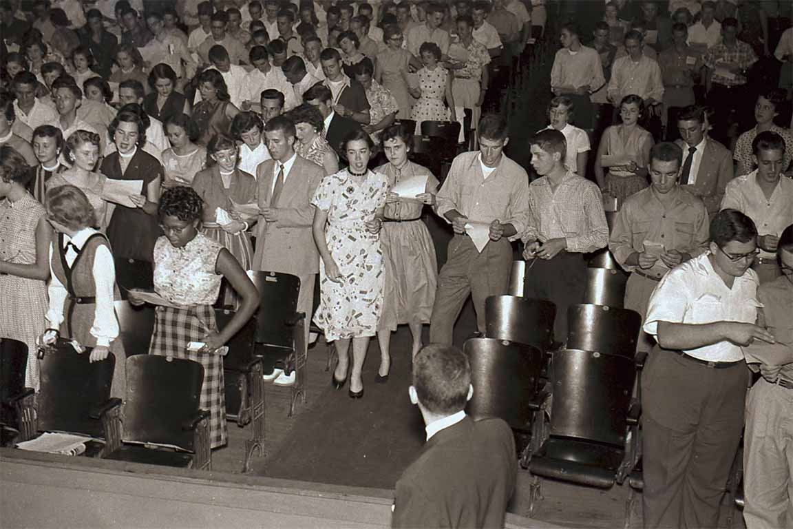 SLU students gathered in an auditorium for freshman orientation in the 1950s.