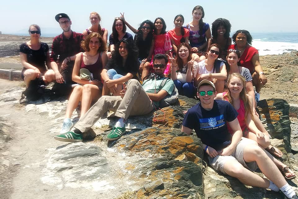 Students from all five institutions pose for a photo at Robben Island, South Africa.
