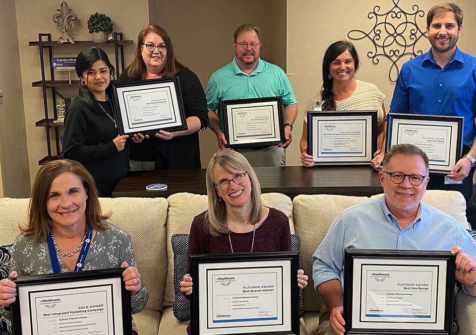 SLUCare marketing team. Front row, from left, are Kathy Kruse, Cherie Burroughs and Tony Stubblefield. Back row, from left, are Imelda Gonzalez, Sarah Gladson, Tracy Santhuff, Andrea Zimmerman and Kristofor Long. SLU Photo.