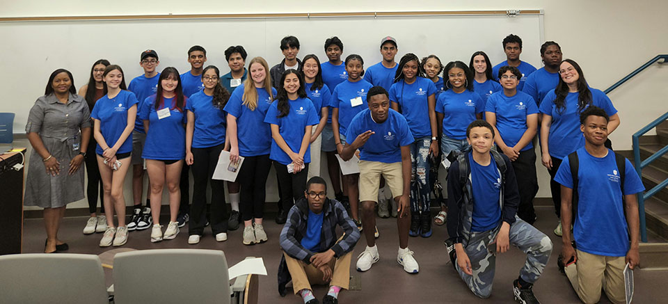  Group photo of Summer Scholar Program participants.  Program Director, Fannie Acoff on left and medical students Caroline Wright (second row, right) and Tyric Goode (third row, right). 