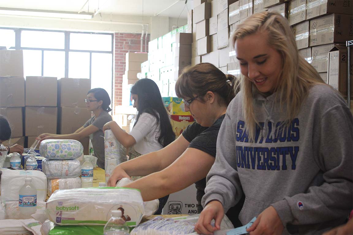 SLU students volunteer at the St. Louis Diaper Bank.