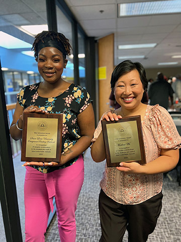 TRIO Award Educational Advisor Mia Davis and Academic Coordinator Marlene Wu pose with their awards from St. Louis Public Schools. SLU TRIO Educational Talent Search was named the Higher Ed Partner of the Year for Overground Railroad, Tutoring, College Readiness, TRIO program, SLU Mentors, and SLU Make a Difference Day. Academic Coordinator Marlene Wu was also recognized with a Volunteer Award. Photo submitted.