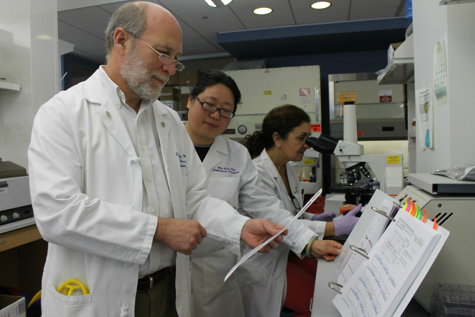 Daniel Hoft, M.D., Ph.D. in the lab with colleagues