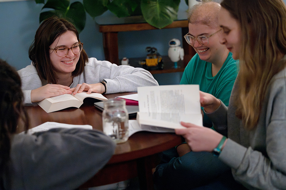 Three female Billiken Teachers talk around a round table. Three female Billiken Teachers talk around a round table.