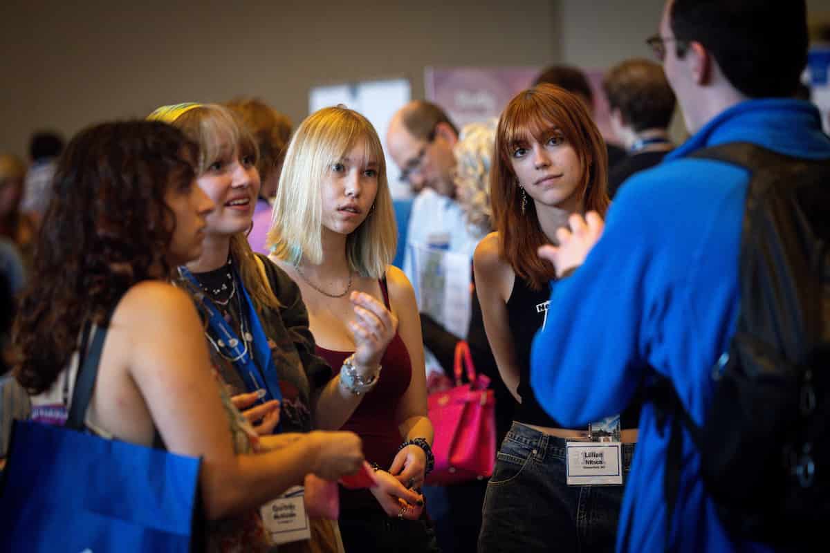 Students talk in a crowded hallway