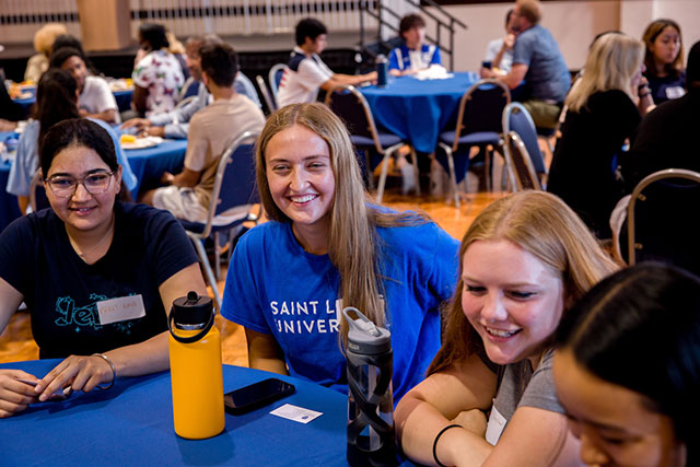 First-year students sitting together at a table