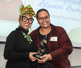 Luella Loiselle presenting Donna Bess Myers with an award