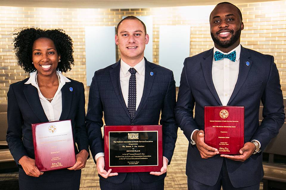 Left to right: Brianna Clare, Matt Glassman and Kwamane Liddell hold their plaques from the NAHSE student case competition.
