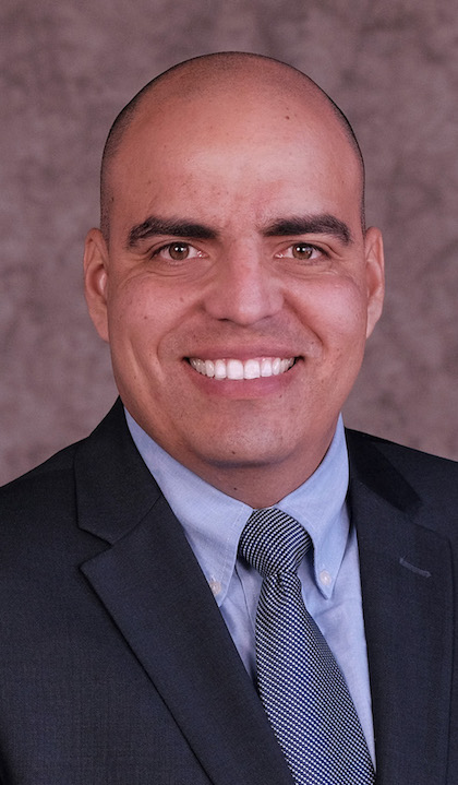 Enrique Flores, a graduate of the urban planning and development program, at Saint Louis University's College for Public Health and Social Justice.