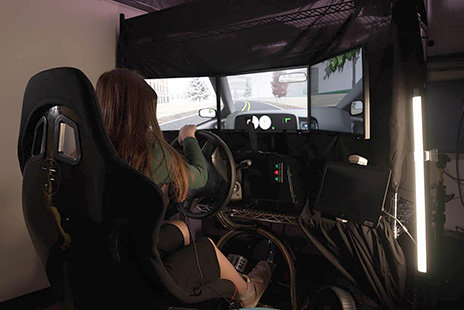 A teen using the driving simulator described in the story.