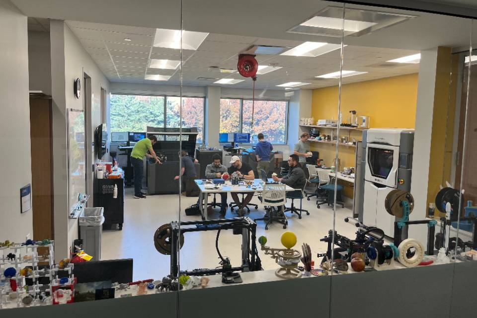 A view of the SLU-CAM lab space with members working within