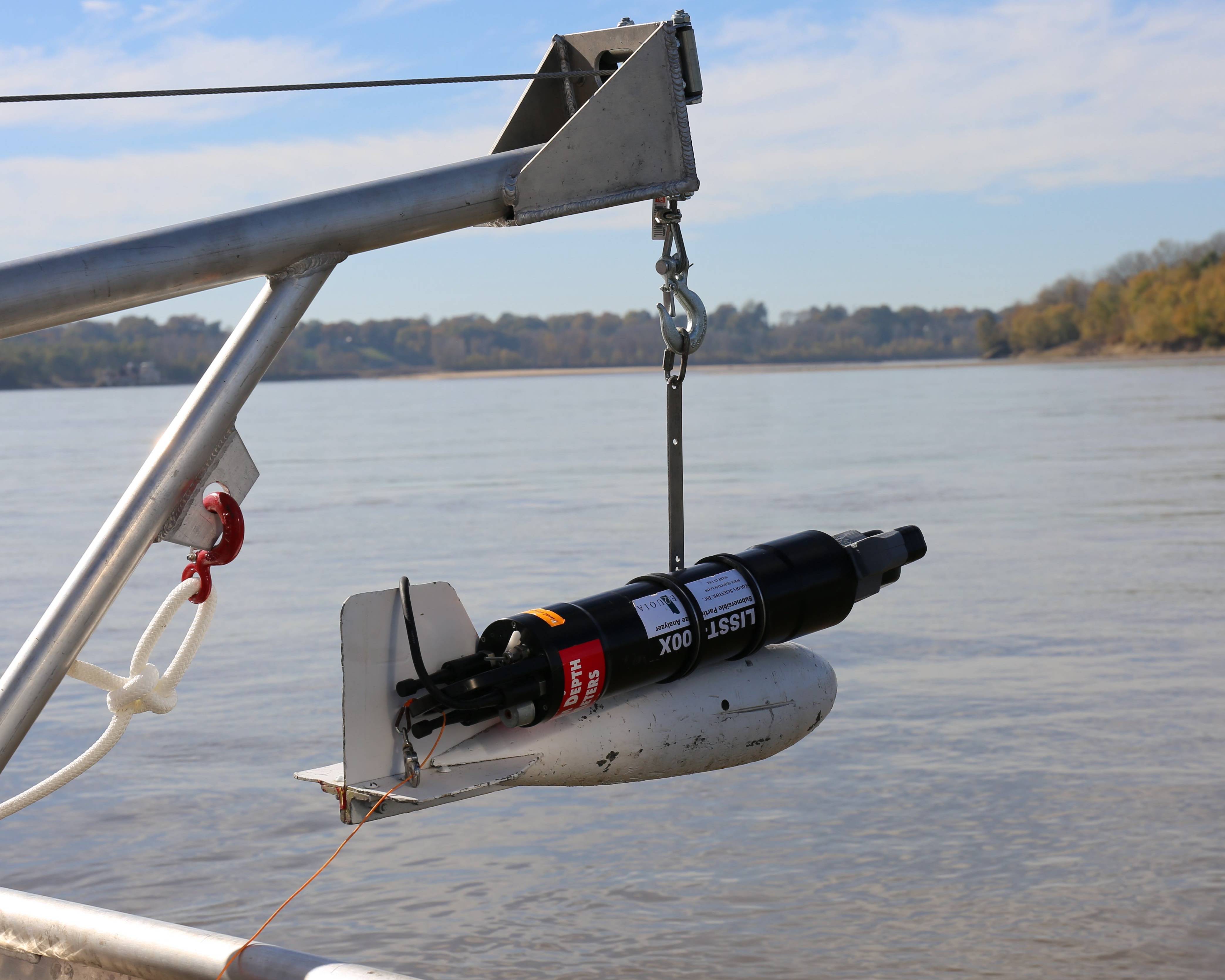 Laser-diffraction Particle Size Analyzer about to be deployed off a boat into the Mississippi River