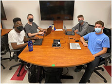 bicycle rack on rapid transportation team Students seated around a table