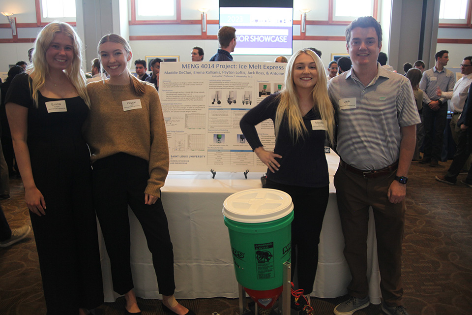 Student pose with their poster project at the SSE Undergraduate Research Showcase.