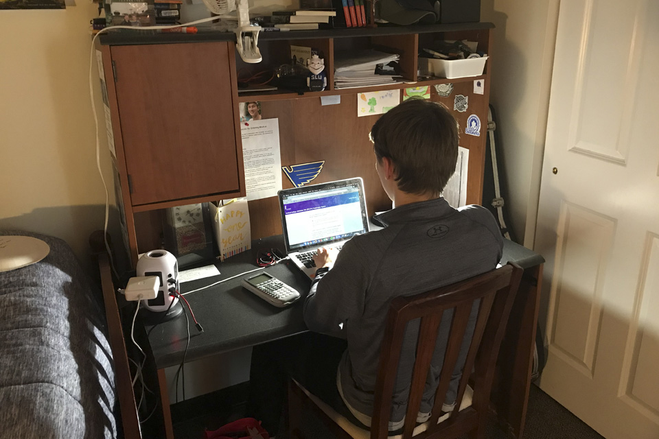 Joseph Reznikov works from his off-campus apartment in May.