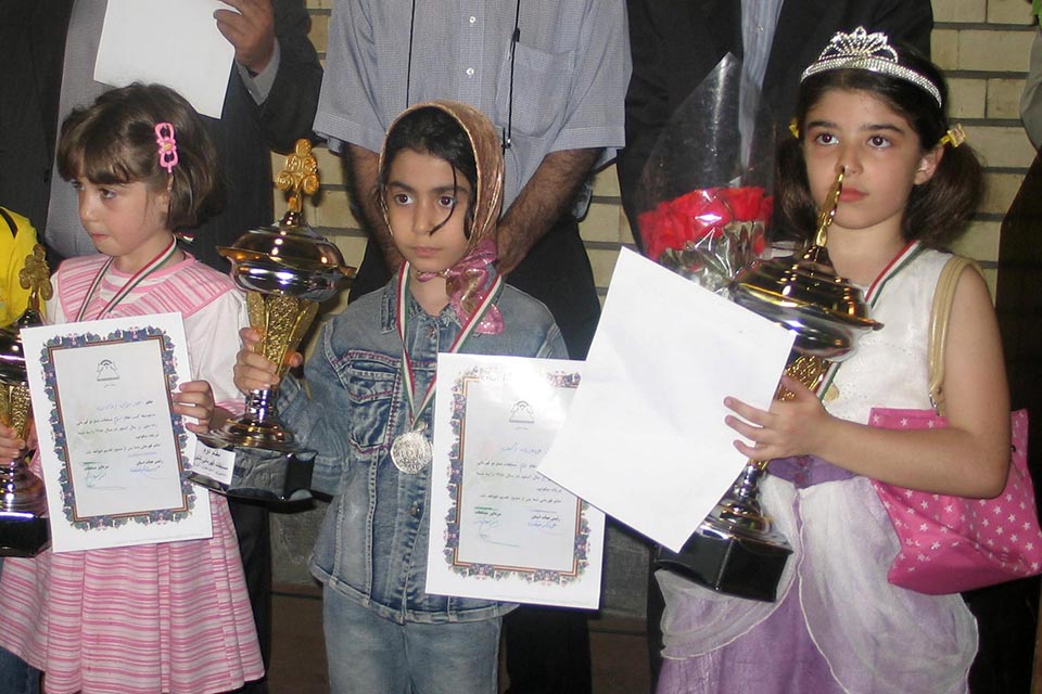 Derakhshani stands with other girls after one of her first chess tournaments