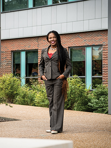 Danielle Davis, a professor of higher education at SLU, stands on campus.