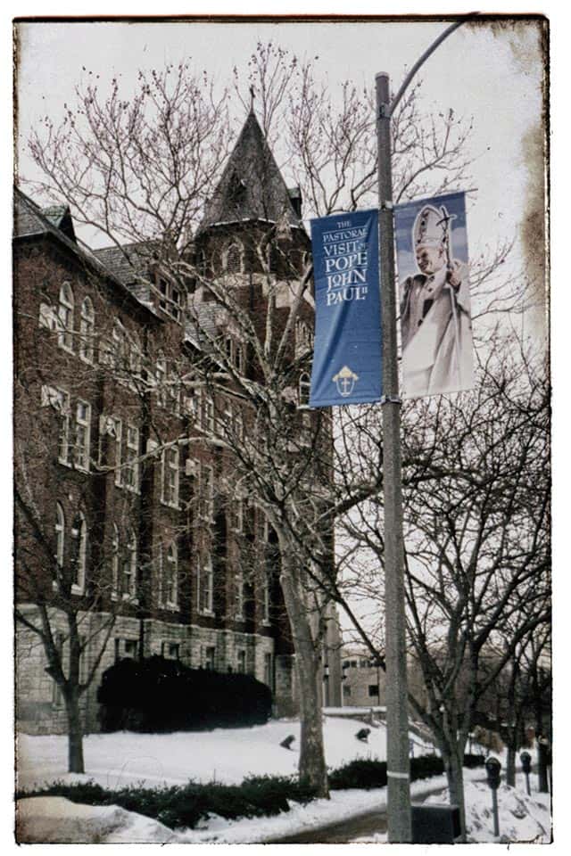 A close up of a SLU banner promoting the Papel visit