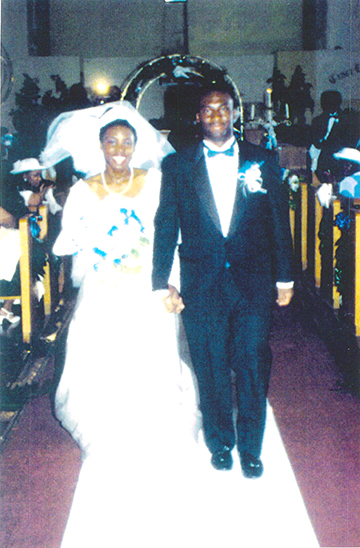 Anderson and her husband on their wedding day Anderson and her husband walk down the aisle on their wedding day.