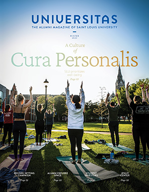 The Winter 2023 Universitas cover depicts SLU community members practicing yoga outdoors